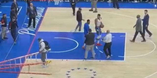 Giannis Antetokounmpo pushes work ladder to floor following loss to Sixers. (Credit: @dem389)