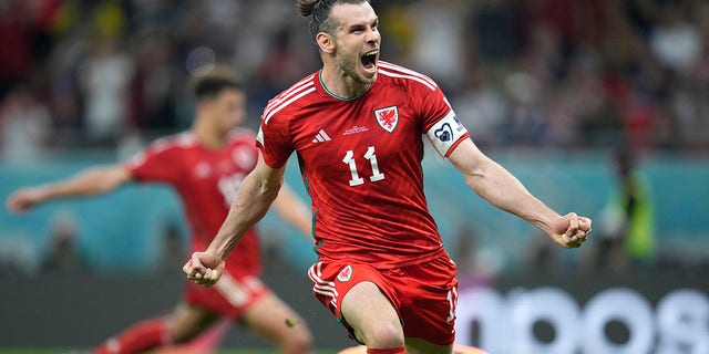 Gareth Bale of Wales celebrates after scoring his team's first goal during the World Cup Group B soccer match between USA and Wales at Ahmad Bin Ali Stadium, Doha, in Qatar on Monday, November 21, 2022. 