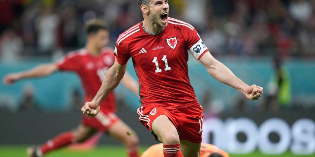 Wales' Gareth Bale celebrates after scoring his side's opening goal during the World Cup, group B soccer match between the United States and Wales, at the Ahmad Bin Ali Stadium in Doha, Qatar, Monday, Nov. 21, 2022.