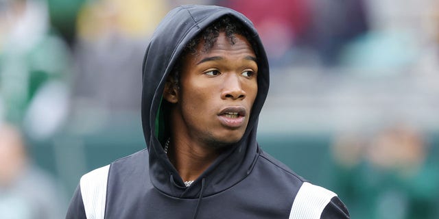 Garrett Wilson, #17 of the New York Jets, looks on during pregame at Lambeau Field on Oct. 16, 2022 in Green Bay, Wisconsin.