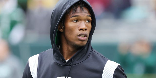 Garrett Wilson, #17 of the New York Jets, looks on during pregame at Lambeau Field on Oct. 16, 2022 in Green Bay, Wisconsin.