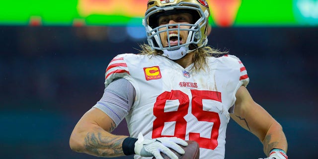 George Kittle, #85 of the San Francisco 49ers, celebrates after catching a pass for a touchdown against the Arizona Cardinals during the second quarter at Estadio Azteca on Nov. 21, 2022 in Mexico City.