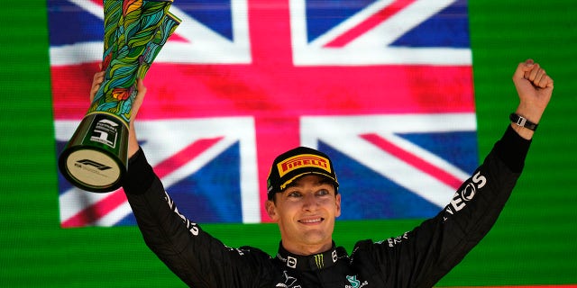 Mercedes driver George Russell, of Britain, celebrates his victory in the Brazilian Formula One Grand Prix at the Interlagos Racetrack in Sao Paulo Sunday, Nov.13, 2022.