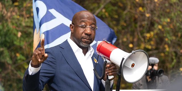 Senator Raphael Warnock meets with community members to encourage them to come out and vote on the first day of early voting on October 17, 2022 in Duluth, Georgia.