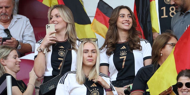 Sophia Weber, right, in the stands for Germany's match against Japan on Nov. 23, 2022, in Doha, Qatar.