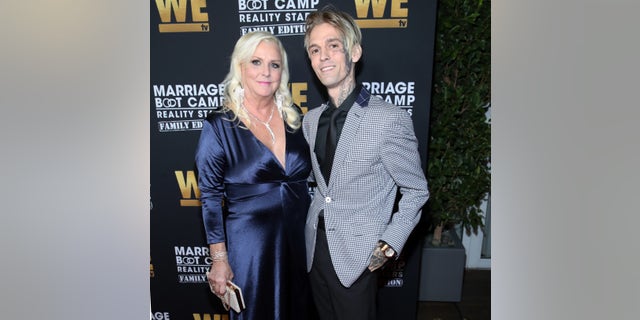 Aaron Carter with his mom Jane Carter at an event