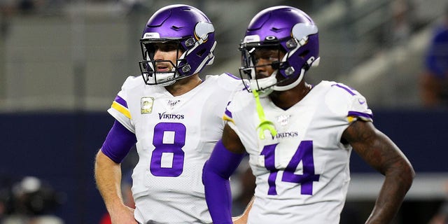 Kirk Cousins (8) and Stefon Diggs (14) of the Minnesota Vikings stand on the field during a game against the Dallas Cowboys at AT and T Stadium Nov. 10, 2019, in Arlington, Texas. 