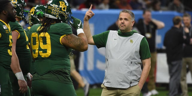 Baylor Bears head coach Matt Rhule talks to his players during warmups before the Allstate Sugar Bowl against the Georgia Bulldogs on January 1, 2020 at the Mercedes-Benz Superdome in New Orleans, Louisiana.