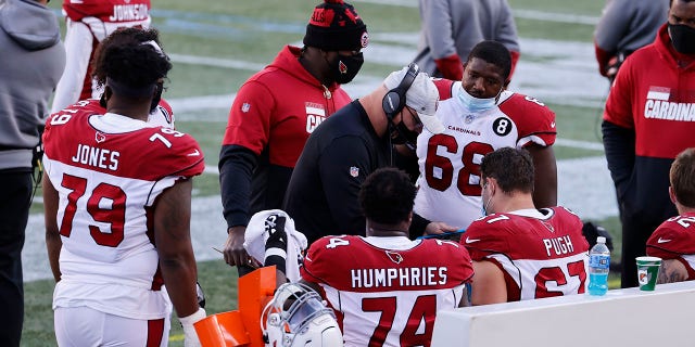 Arizona Cardinals offensive line coach Sean Kugler talks to his players during a game against the New England Patriots Nov. 29, 2020, at Gillette Stadium in Foxborough, Mass. 