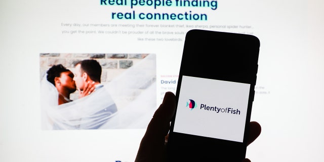 File photo of Plenty of Fish app logo is displayed on a mobile phone screen photographed on Plenty of Fish website background. Police in Wisconsin are warning women about being victimized by a man they are meeting on dating apps. 