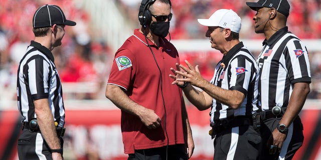 Nick Rolovich, head coach of the Washington State Cougars, talks with officials during a game against the Utah Utes Sept. 25, 2021, at Rice-Eccles Stadium in Salt Lake City, Utah. 