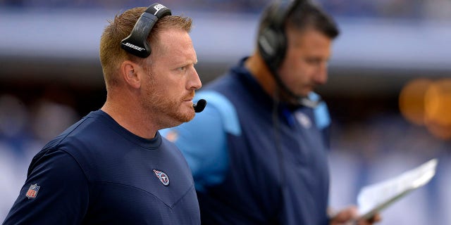 Tennessee Titans offensive coordinator Todd Downing looks on as Tennessee Titans Head Coach Mike Vrabel checks his play card during the NFL football game between the Tennessee Titans and the Indianapolis Colts on Oct. 31, 2021, at Lucas Oil Stadium in Indianapolis.