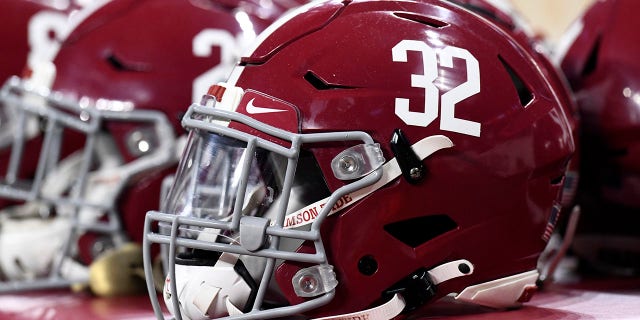 Alabama Crimson Tide helmets sit on the sideline during their championship game against the Georgia Bulldogs on Jan. 10, 2022, at Lucas Oil Stadium in Indianapolis, Indiana.