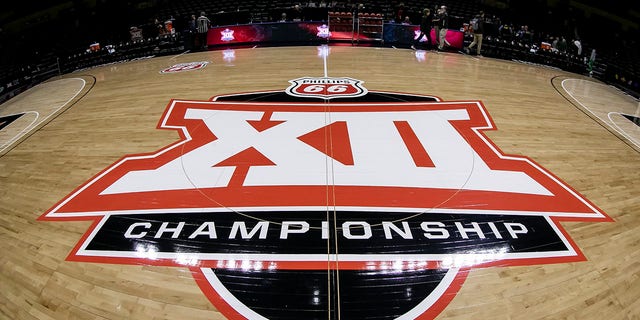 The Big 12 logo is on display at center court during a Big 12 women's tournament game between the Baylor Bears and the Oklahoma State Cowgirls March 11, 2022, at Municipal Auditorium in Kansas City, Mo.  