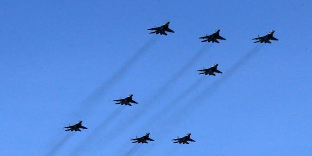 Mikoyan MIG-29, NATO reporting name: Fulcrum, jet fighters show the letter "Z", a symbol of the Russian military invasion of Ukraine, over the polygon during the parade rehearsals, April 18, 2022 in Alabino, outside of Moscow.