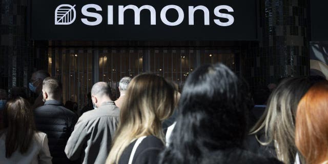 Shoppers wait for the opening of Simons' 16th location at the CF Fairview Pointe Claire in Pointe-Claire, Quebec, Canada, on Thursday, May 5, 2022. CEO Bernard Leblanc discussed his first month at the helm of the company, his priorities for the next 12 to 18 months, and why Simons continues to believe in its network of stores when other companies are relying primarily on the web.