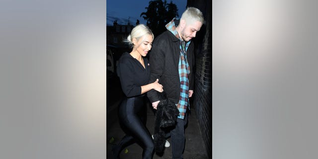 Kim Kardashian and Pete Davidson matching while walking around London.