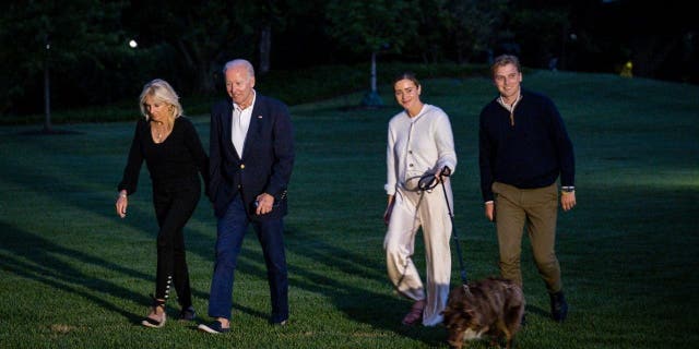 President Biden, first lady Jill Biden, grandaugher Naomi Biden and fiance Peter Neal walk to the White House from Marine One on June 20, 2022, in Washington.