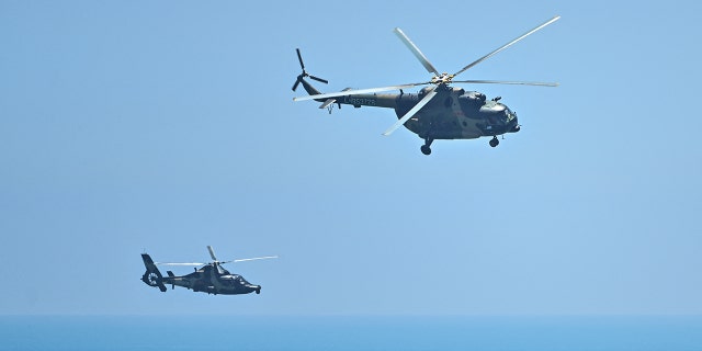 Chinese military helicopters fly over Pingtan Island, one of mainland China's closest points to Taiwan, Fujian Province, Aug. 4, 2022.