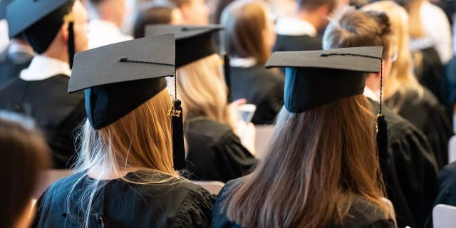 College graduates in cap and gown