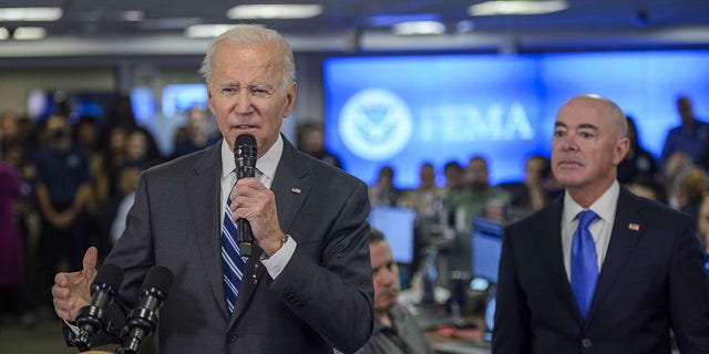 President Joe Biden speaks beside DHS Secretary Alejandro Mayorkas at the Federal Emergency Management Agency (FEMA) headquarters in Washington, DC, US, on Thursday, Sept. 29, 2022. 