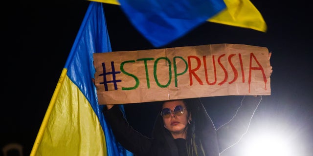 Ukrainian citizens and supporters attend a demonstration of solidarity with Ukraine in Krakow, Poland, on Oct. 10, 2022.