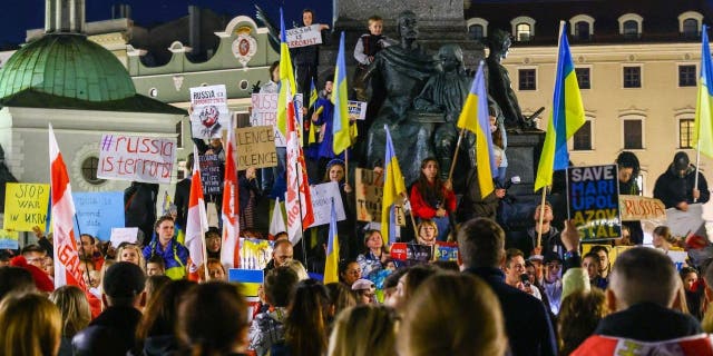 Ukrainian citizens and supporters attend a demonstration of solidarity with Ukraine at the Main Square, after latest Russian missiles targeted civilian infrastructure in several cities in Ukraine. Krakow, Poland on October 10, 2022.