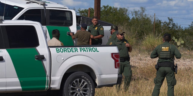 An illegal migrant found smuggled in a vehicle is apprehended by U.S. Border Patrol and the Webb County Sheriff on October 12, 2022, in Laredo, Texas.