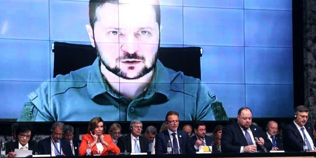 Ukraine's President Volodymyr Zelenskyy speaks via a video link to the opening session of the International Crimea Platform Parliamentary summit, organized by Ukraine and Croatia, in Zagreb, on Oct. 25, 2022.