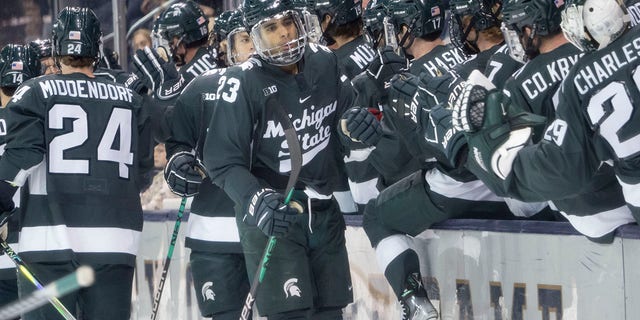 Michigan State Spartans forward Jagger Joshua, #23, celebrates after scoring a goal during a men's college hockey game between the Michigan State Spartans and the Notre Dame Fighting Irish on October 29, 2022 at Compton Family Ice Arena in South Bend, Indiana.