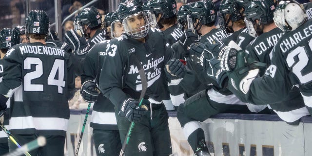 Michigan State Spartans forward Jagger Joshua, #23, celebrates after scoring a goal during a men's college hockey game between the Michigan State Spartans and the Notre Dame Fighting Irish on October 29, 2022 at Compton Family Ice Arena in South Bend, Indiana.