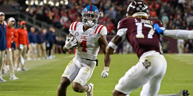 Mississippi Rebels running back Quinshon Judkins (4) gets to the edge as Texas A and M Aggies defensive back Jaylon Jones (17) closes in during a game at Kyle Field Oct. 29, 2022, in College Station, Texas. 