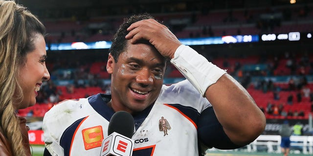 Denver Broncos' Russell Wilson is interviewed during the NFL International match at Wembley Stadium, London. Picture date: Sunday October 30, 2022. 