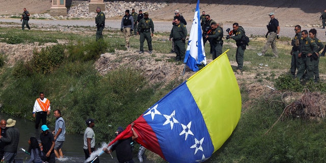 Border Patrol agents from the El Paso sector fire rubber bullets to a group of Venezuelan migrants as they cross the Rio Bravo (or Rio Grande, as it is called in the US), after a demonstration against U.S. immigration policies in Ciudad Juarez, Mexico, on October 31, 2022.