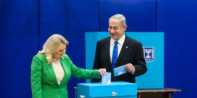 Former Israeli Prime Minister and Likud party leader Benjamin Netanyahu and his wife Sara Netanyahu cast their vote in the Israeli general election on Nov. 1, 2022 in Israel.
