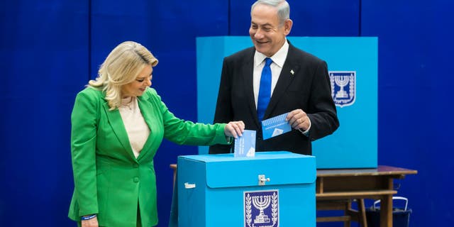 Former Israeli Prime Minister and Likud party leader Benjamin Netanyahu and his wife Sara Netanyahu cast their vote in the Israeli general election on Nov. 1, 2022 in Israel.