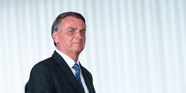 Brazilian President Jair Bolsonaro arrives for a press conference two days after narrowly defeating Lula da Silva in the second round of the presidential election at Alvarado Palace on November 1, 2022 in Brasilia, Brazil.  Bolsonaro did not admit his defeat and asked his supporters to protest peacefully, but to allow free transit through the country. 