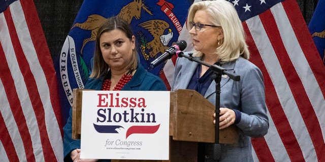 Then-Rep. Liz Cheney (R-WY), right, campaigns for Democrat Rep. Elissa Slotkin (D-MI) at a rally on Nov. 1, 2022 in East Lansing, Michigan.