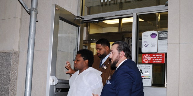  Carl Phanor, 29, being taken by NYPD Detectives from the NYPD Special Victims Unit to be arraigned in Manhattan Criminal Court on Nov. 3, 2022. 