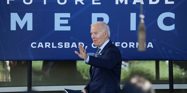 US President Joe Biden speaks with dignitaries and employees at ViaSat on November 4, 2022 in Carlsbad, California. 