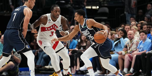 Spencer Dinwiddie of the Mavericks dribbles the ball against the Toronto Raptors on Nov. 4, 2022, at the American Airlines Center in Dallas. 