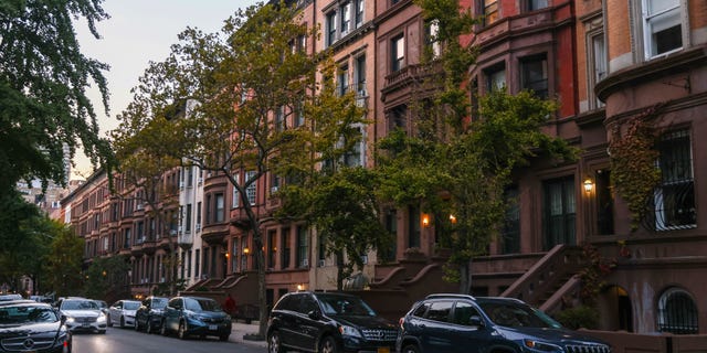Brownstone apartment buildings in Manhattan, New York, United States on October 22, 2022.