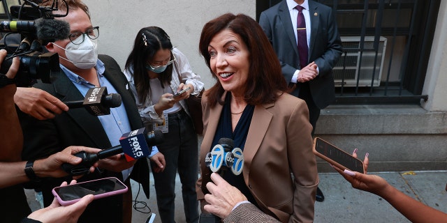 New York Gov.  Kathy Hochul talks to reporters after visiting the Hamilton Housing Development on West 73rd Street and Broadway in the Upper West side of Manhattan, New York. 