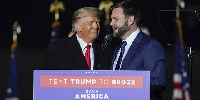 JD Vance, co-founder of Narya Capital Management LLC and Ohio Republican Senate candidate, right, talks onstage with former President Trump during a "save America" rally in Vandalia, Ohio, Monday, November 7, 2022. 