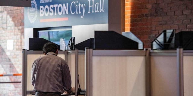 A person fills out their ballot in Boston City Hall in the US midterm election, in Boston on Nov. 8, 2022. 