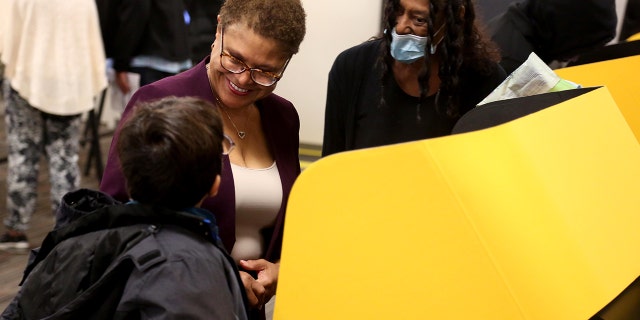Los Angeles mayoral candidate Rep. Karen Bass, with her grandson Henry, 8, casts her vote at the Baldwin Hills Crenshaw Center in Los Angeles on Nov. 8.