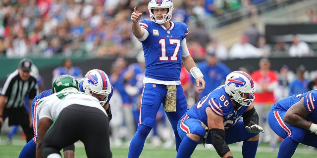 The Buffalo Bills' Josh Allen (17) looks over the New York Jets' defense at Met Life Stadium in East Rutherford, N.J., Nov. 6, 2022.