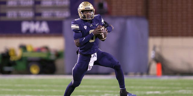 Akron Zips quarterback DJ Irons, #0, scrambles during the first quarter of the college football game between the Eastern Michigan Eagles and Akron Zips on Nov. 8, 2022, at Summa Field at InfoCision Stadium in Akron, Ohio.