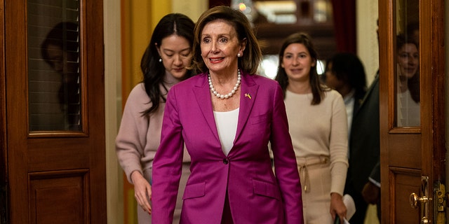 House Speaker Nancy Pelosi, D-Calif., walks down the halls of Congress on Capitol Hill on Monday, Nov. 14, 2022, in Washington, DC. 