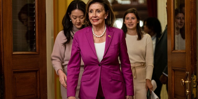House Speaker Nancy Pelosi, D-Calif., walks down the halls of Congress on Capitol Hill on Monday, Nov. 14, 2022, in Washington, DC.